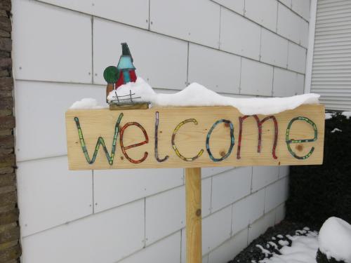 a sign that says welcome with snow on it at Carpe Diem in Bullange