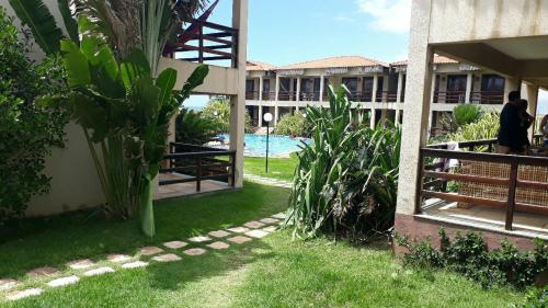 Bazén v ubytování TAIBA - ONDAS DO MAR RESIDENCE Ap 212 nebo v jeho okolí
