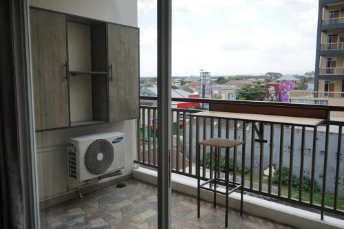a balcony with a air conditioner and a heater at Student park apartment in Seturan