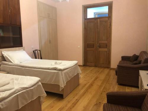 Ένα ή περισσότερα κρεβάτια σε δωμάτιο στο Cozy House