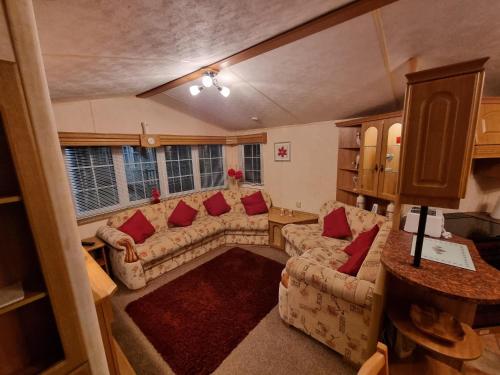 an overhead view of a living room with couches at palm grove 16 in Skegness