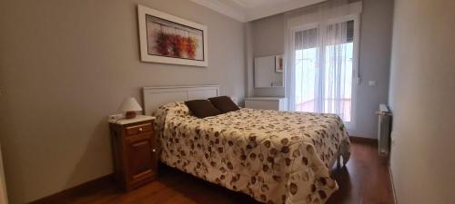 a bedroom with a bed and a window at CIRCUNVALACION in Albacete