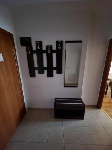 a room with a mirror on a wall at Suite Roma 2 at Spa Club Bor in Velingrad