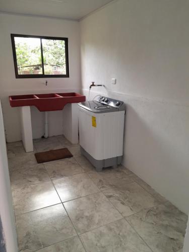 a bathroom with a sink and a tub and a counter at Casa vista de luna in Guaria