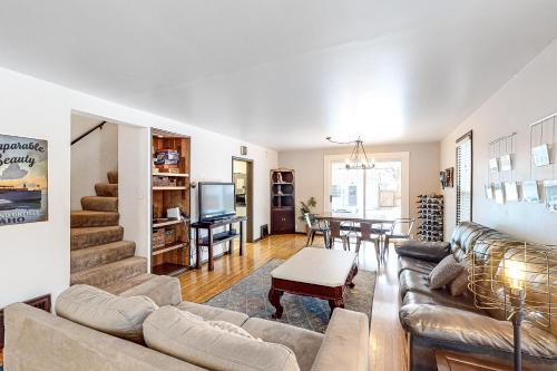 a living room with a couch and a table at The Perfect Sandpoint Rental in Sandpoint