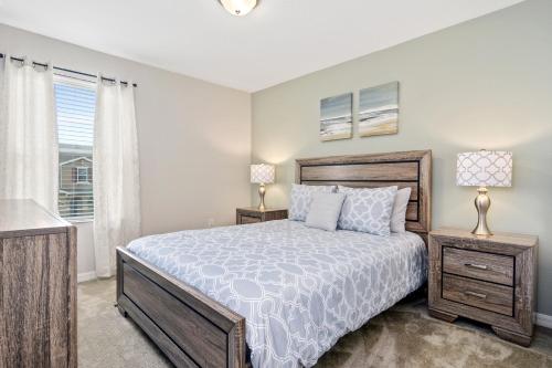 a bedroom with a bed and a window at Family Friendly Four Bedrooms 5145 in Kissimmee