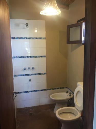 a bathroom with a toilet and a sink at Ranchos en Payogasta - Cachi in Payogasta