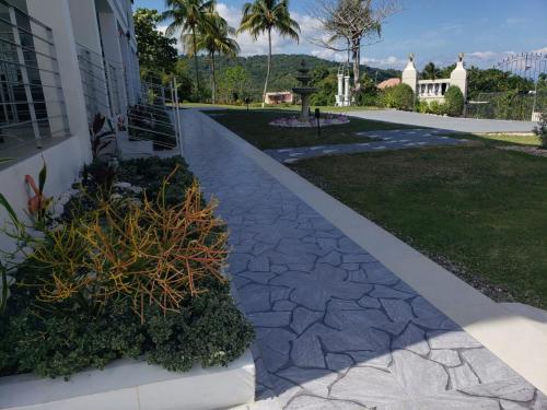 a walkway in front of a house at Lavender Moon Villas in Breadnut Hill