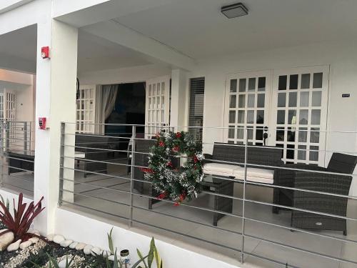a christmas wreath on the balcony of a house at Lavender Moon Villas in Breadnut Hill