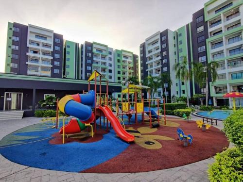 a playground in front of a building with a slide at B3 Superb PoolView Manhattan Waterpark Homestay Ipoh4-8Pax NETFLIX in Ipoh