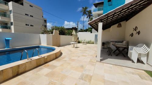 Πισίνα στο ή κοντά στο Flat beira mar a 30m do mar 200m das piscinas de Porto Mahalo Residence P-2-4e 6 pessoas