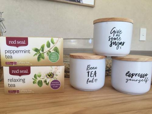 a group of three cups sitting on top of a counter at Cosy Studio on Hyde in Taupo