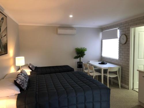 Ένα ή περισσότερα κρεβάτια σε δωμάτιο στο Estelle Kramer Motel