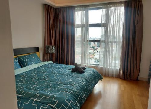 Ένα ή περισσότερα κρεβάτια σε δωμάτιο στο Apartment by WGS Homestay