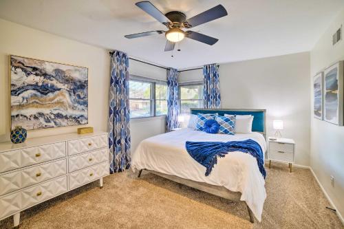 a bedroom with a bed and a ceiling fan at Spacious Riverside Home with Game Room and Yard in Riverside
