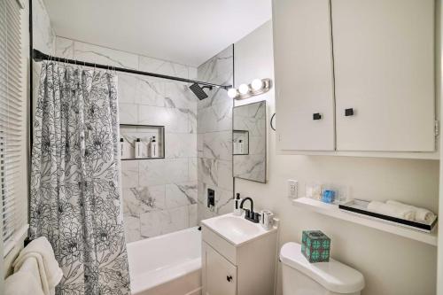 a bathroom with a shower sink and a toilet at Spacious Riverside Home with Game Room and Yard in Riverside