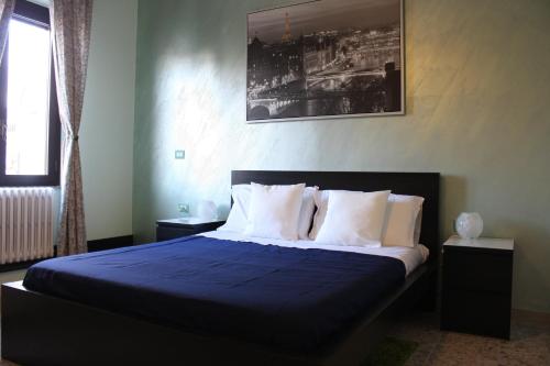 Bed & Breakfast La Perla Rosa tesisinde bir odada yatak veya yataklar