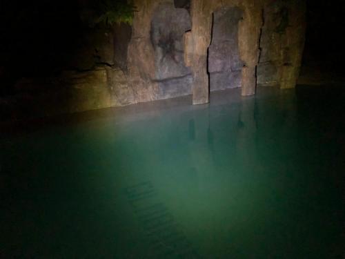 a pool of water in a cave at night at Cabañas De Madera Y Bungalows - Gilmañas 3 in La Iruela