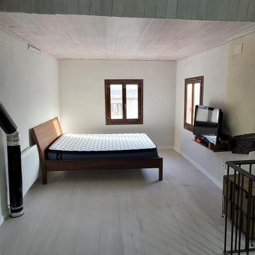 Una cama o camas en una habitación de CAL MA Ponts