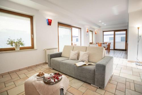 a living room with a couch and a table at Apartment Ajdi in Ajdovščina