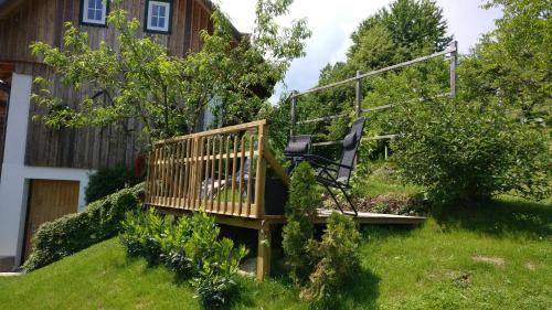 a wooden deck in the yard of a house at Winzerhaus im Schilcherland in Steinreib