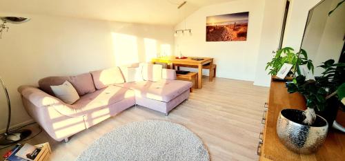 a living room with a couch and a table at Sanosueno 2 in Sonthofen