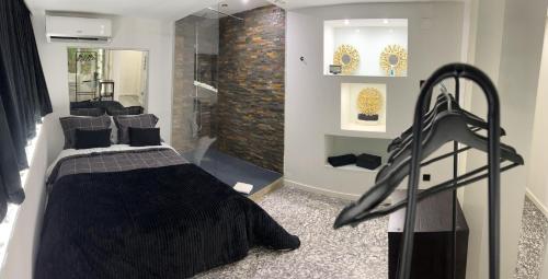 a bedroom with a bed and a walk in shower at Modern Room with Indoor Shower Near the River - Quarto Moderno com Duche interior Próximo da Ribeira in Vila Nova de Gaia