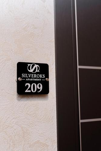 a sign on a wall that readssilverlords aquarium at Silveroks Apartment in Prilimanskoye