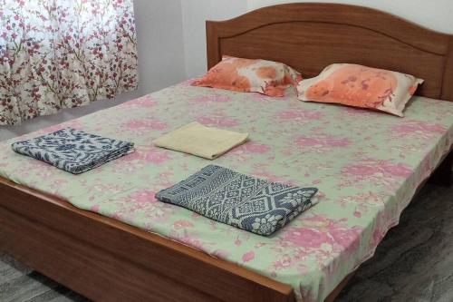 a bed with two pillows on top of it at The City Centre, Panaji, North Goa in Panaji