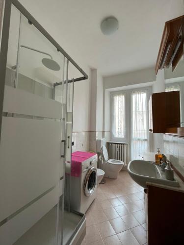 a bathroom with a washer and a washing machine at House vittone venaria reale 2 in Venaria Reale