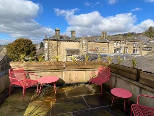 a group of chairs and tables on a roof at Serendipity in Pateley Bridge