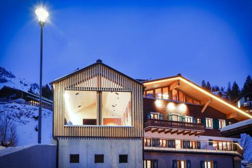 a house with a large window on the side of it at Chalet Sonnblick in Stuben am Arlberg