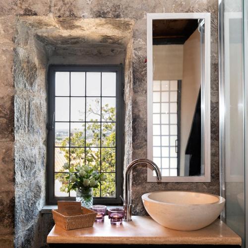 a bathroom with a large sink and a window at Torre Di Vico Residenza D'Epoca in Viterbo