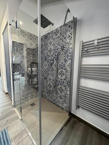 a bathroom with a shower with a glass door at Family Inn in San Maurizio Canavese