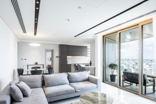 a living room with a couch and a table at 360 Nicosia - 2 bedrooms Luxury Residence in Nicosia