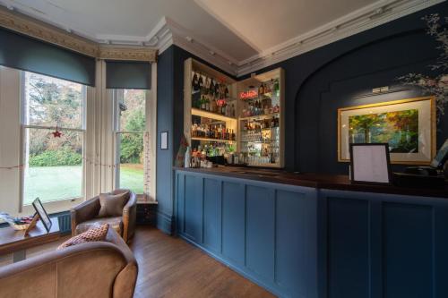 a blue bar in a room with a window at Beechfield House in Beanacre