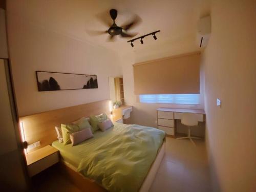 a bedroom with a bed and a ceiling fan at RumaMuji Kita KLIA, Putrajaya, Cyberjaya Musliem Only in Sepang