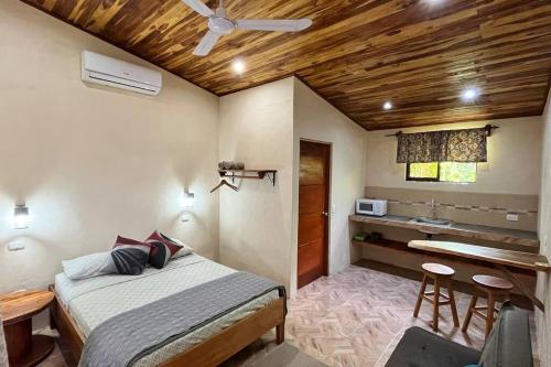 a bedroom with a bed and a sink in it at Apartamento Entero El Guanacaste. in Santa Cruz