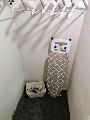 a skateboard hanging on a wall next to a box at Rosa House in Darlington