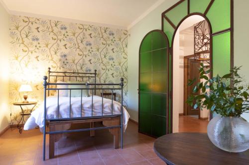 a bedroom with a bed and a table at Villa Forre 563 in Reggello