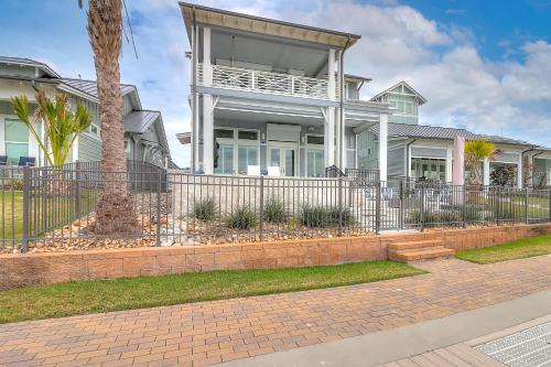 a large house with a fence in front of it at Waterfront Paradise, Private Pool & Dock, Poolside TV & Multi-TV Game Room in Rockport