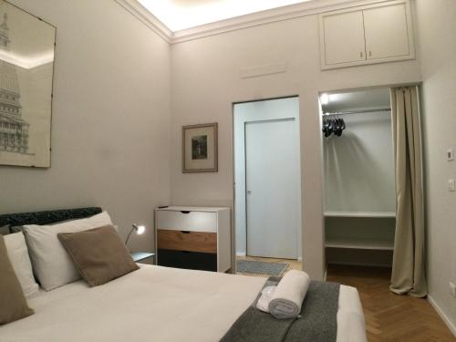 a bedroom with a bed and a walk in shower at Suite Florio in Turin