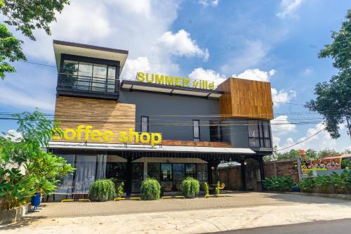 a building with a sign that reads summer shop at Hotel Summerville in Majalengka
