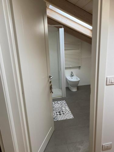 a bathroom with a toilet and a sink at Cascina Jesolana in Lido di Jesolo