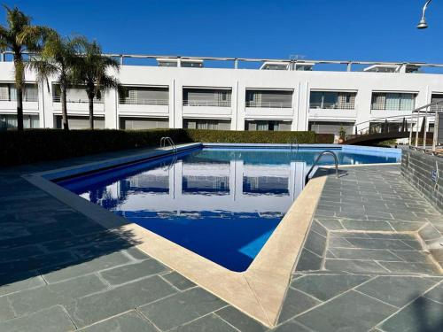 a swimming pool in front of a building at Charming Tavira - Pools Pet-Friendly Golf in Tavira