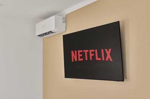 a sign on a wall with a netflix sign on it at Boardinghotel Premium Heidelberg in Heidelberg