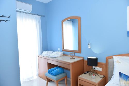a bathroom with a sink and a mirror at ChristiAnna Luxury Apartments in Almyrida