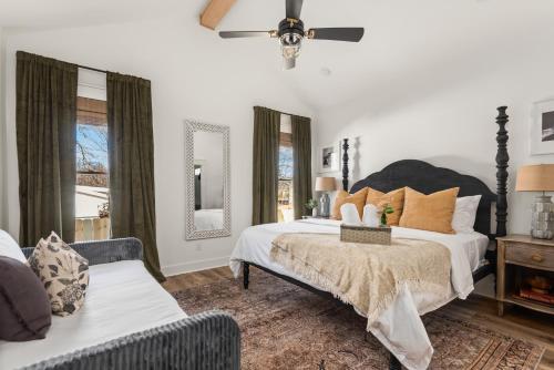 a bedroom with two beds and a couch at Southbound Stays - Country Cottage in Nashville