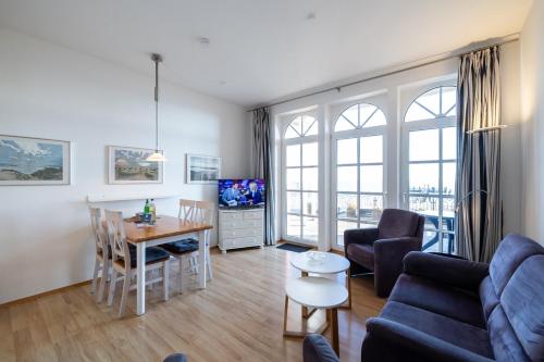 TV a/nebo společenská místnost v ubytování Nordland Appartements - Wohnung Nordstrand