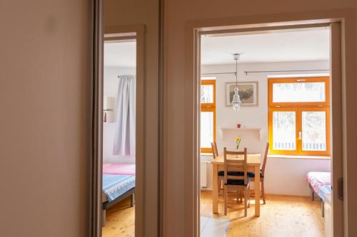 a room with a table and a dining room at Penzion U hájovny u pískoven - Vlkov in Vlkov